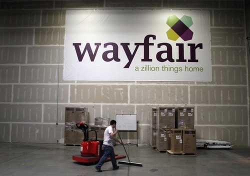 Rick Egan  | The Salt Lake Tribune 

Brandon Myers works in the Wayfair  warehouse, in Ogden, Friday, April 20, 2012.   The company plans to hire 100 by year's end.