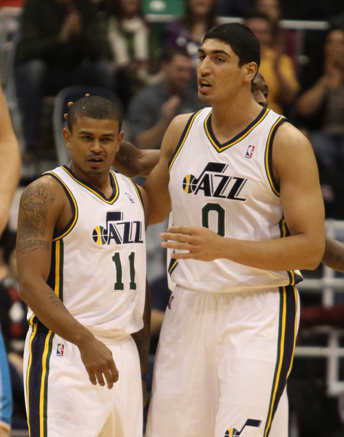Rick Egan  | The Salt Lake Tribune 

Utah Jazz point guard Earl Watson (11) a is patted on the back by Enes Kanter (0) after he drew a charging foul, in NBA action, Utah Jazz vs. The New Orleans Hornet's, at EnergySolutions Arena, Monday, January 2, 2012.