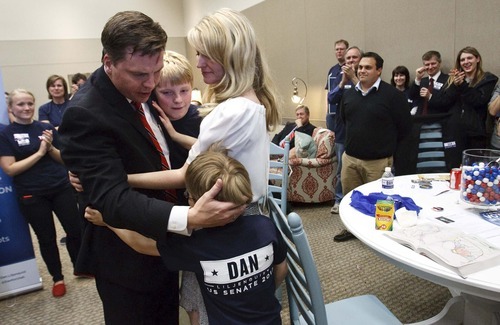Leah Hogsten  |  The Salt Lake Tribune
Former state Sen. Dan Liljenquist hugs his wife Brooke and sons Nate, 7, and Ben, 4, after learning that he and Sen. Orrin Hatch will face a primary election. Hatch came up just short of the support needed to claim his party's nomination for the seventh time, forcing him into a primary in June. After two rounds of balloting, Hatch had the support of 59.1 percent, a handful of votes short of the 60 percent threshold to claim the nomination outright.The Utah Republican Party held its nominating convention Saturday, April 21 2012 in Sandy at the South Towne Exposition Center.