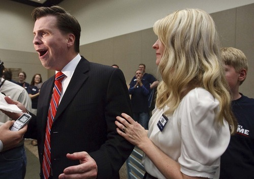Leah Hogsten  |  The Salt Lake Tribune
Former state Sen. Dan Liljenquist wipes sweat from his brow while talking to reporters with his wife Brooke, after learning that he and six-term Sen. Orrin Hatch will face a primary election. Hatch came up just short of the support needed to claim his party's nomination outright. The two square off in a June 26 primary.
