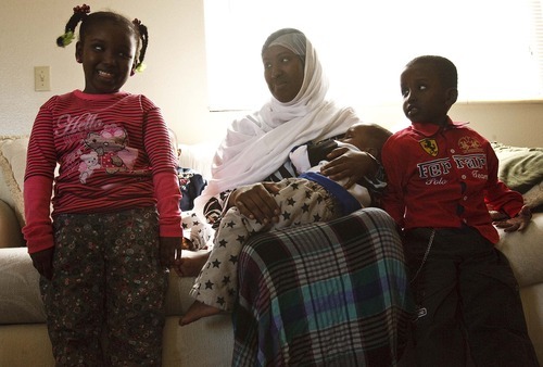 Leah Hogsten  |  The Salt Lake Tribune
Ferdows Omer, center,, breastfeeds her youngest son Abdulrahman Mualim, 1, on April 19 surrounded by her daugher Naval Mualim, 6,  and son Abdollah Mualim, 5. The U.S. has tightened its security checks on incoming refugees, dramatically decreasing the flow of newcomers to Utah and across the nation. Somali refugee Ferdows Omer arrived April 9, 2012 in Utah. 
 Thursday, April 19 2012 in Salt Lake City.