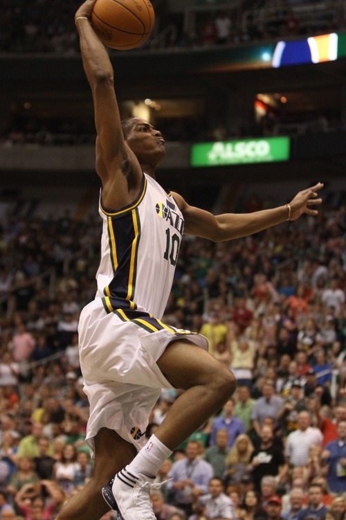 Rick Egan  | The Salt Lake Tribune 

Utah Jazz power forward Derrick Favors (15) gets a slam dunk, in NBA action, Utah Jazz vs. The Orlando Magic, in Salt Lake City,  Saturday, April 21, 2012
