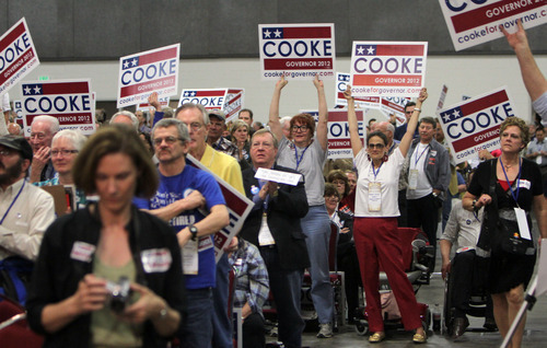 Francisco Kjolseth  |  The Salt Lake Tribune
Supporters of Democrat Peter Cooke, a retired Army Reserve officer running for Utah governor shake their boards during the state Democratic convention on Saturday. Cooke was uncontested in his bid for the nomination. He goes on to face Gov. Gary Herbert in November's election.