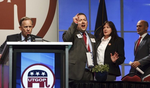 Leah Hogsten  |  The Salt Lake Tribune
Second Congressional District candidate Chuck Williams (left) and one of Williams' staffers (right) are angry after Williams' mic was shut off for calling fellow candidate Chris Stewart a 
