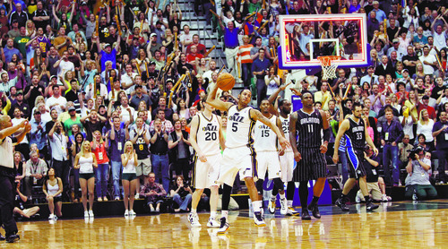 Rick Egan  | The Salt Lake Tribune 

Jazz fans celebrate after Utah Jazz point guard Devin Harris (5) blocked a shot forcing an overtime in NBA action, Utah Jazz vs. The Orlando Magic, in Salt Lake City,  Saturday, April 21, 2012