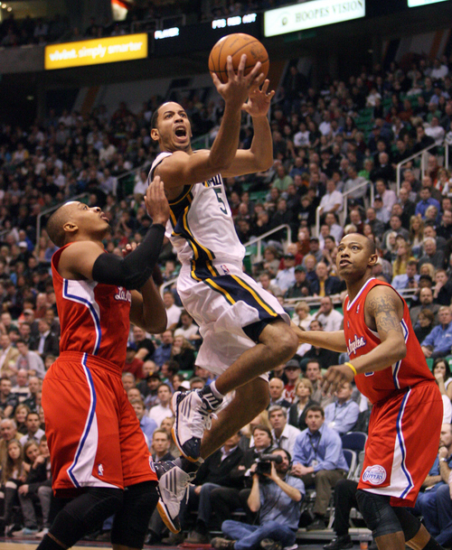 Steve Griffin  |  The Salt Lake Tribune


Utah's Devin Harris splits the defense Randy Foye and Caron Butler, of the Clippers, during first half action of the Utah Jazz versus Los Angeles Clippers game at EnergySolutions Arean in Salt Lake City, Utah  Tuesday, January 17, 2012.