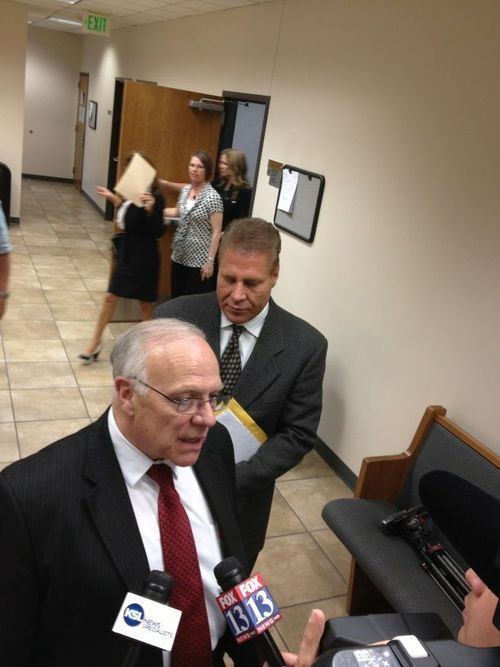 Aaron Falk | The Salt Lake Tribune
Orem plastic surgeon Joseph Edward Berg stands with his attorney Dean Zabriskie (at microphone) outside a sentencing hearing Monday in 4th District Court in Provo. Berg, convicted of kidnapping and assaulting his longtime girlfriend, was sentenced Monday to 180 days in jail followed by 36 months of probation, including anger management an substance abuse treatment.