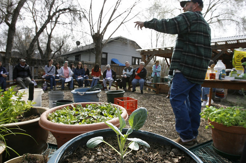 Scott Sommerdorf  |  The Salt Lake Tribune             
Urban homesteader  Jonathan Krausert teaches a class on how to grow vegetables and flowers in colorful containers at Wasatch Community Garden last month.