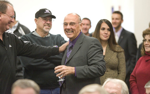 Paul Fraughton | The Salt Lake Tribune
New Weber State head coach John L. Smith is greeted by supporters  before being introduced at a press conference.
  Tuesday, December 6, 2011
