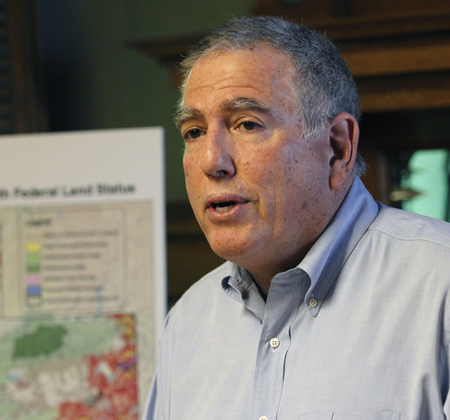 Al Hartmann  |  The Salt Lake Tribune
David Nimkin, regional director for National Parks Conservation Association, speaks at a news conference Tuesday, April 24, about the state of Utah's claim to thousands of dirt roads throughout the state.   The map at left shows a red maze of over 25,000 highway rights of way sought by the state.   SUWA and other conservation and recreation groups contend the case is about wilderness, not transportation.