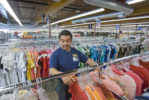 Paul Fraughton | The Salt Lake Tribune.
Store manager Jose Velasco looks over racks filled with clothing at the first Goodwill thrift store in Utah. The store is stocked and ready to open its doors to the public  on April 26th.
 Tuesday, April 24, 2012