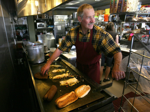 Steve Griffin | The Salt Lake Tribune


 The Italian Place owner John Harder works at the grill during lunch hour at the Logan restaurant.