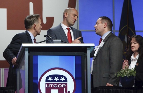 Leah Hogsten  |  The Salt Lake Tribune
Second District Republican contender Chuck Williams (left) and one of his staffers (right) are called to order by Utah Republican Chairman Thomas Wright (center) after Williams said that Chris Stewart was a 