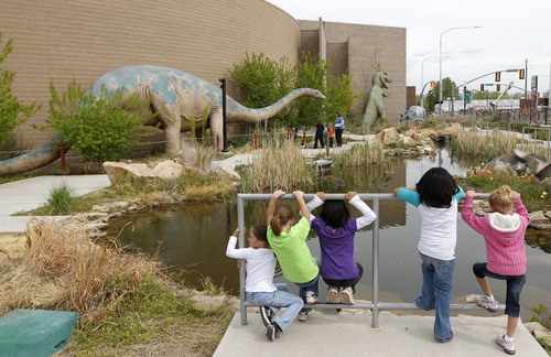 Al Hartmann  |  The Salt Lake Tribune
Schoolchildren take in the dinosaur garden area at the Utah Field House of Natural History State Park Museum in Vernal. Ground was broken Wednesday for a new addition, which will will house fossils and provide a working laboratory for the museum.