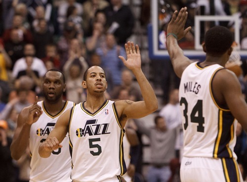 Trent Nelson  |  The Salt Lake Tribune
Utah Jazz guard Devin Harris (5) high-fives Utah Jazz guard/forward C.J. Miles (34) after hitting the go-ahead basket to win the game. Utah Jazz vs. Miami Heat, NBA basketball at EnergySolutions Arena Friday, March 2, 2012 in Salt Lake City, Utah. Utah Jazz center/forward Al Jefferson (25) at left.