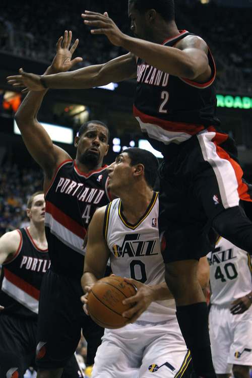Chris Detrick  |  The Salt Lake Tribune
Utah Jazz forward Enes Kanter (0) is guarded by Portland Trail Blazers center Kurt Thomas (40) and Portland Trail Blazers guard Wesley Matthews (2) during the fourth quarter of the game at EnergySolutions Arena Thursday April 26, 2012. The Jazz won the game 96-94.