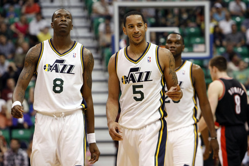 Chris Detrick  |  The Salt Lake Tribune
Utah Jazz small forward Josh Howard (8) Utah Jazz point guard Devin Harris (5) and Utah Jazz center Al Jefferson (25) walk off of the court during the first quarter of the game at EnergySolutions Arena Thursday April 26, 2012. The Jazz are winning the game 23-16.