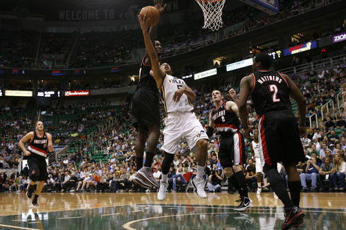 Chris Detrick  |  The Salt Lake Tribune
Utah Jazz point guard Devin Harris (5) shoots past Portland Trail Blazers power forward J.J. Hickson (21) during the first quarter of the game at EnergySolutions Arena Thursday April 26, 2012. The Jazz are winning the game 23-16.