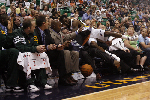 Chris Detrick  |  The Salt Lake Tribune
Utah Jazz forward DeMarre Carroll (3) falls into the Jazz bench during the first quarter of the game at EnergySolutions Arena Thursday April 26, 2012. The Jazz are winning the game 23-16.