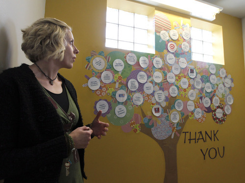 Al Hartmann  |  The Salt Lake Tribune
South Valley Sanctuary in West Jordan provides shelter and support services for victims of domestic violence. Staff member Jennifer Campbell stands by a thank you tree showing corporate sponsors and volunteers that have donated money and household items that help them to be able to provide services. It is among 25 nonprofits to win $2,500 grants from the health insurer SelectHealth.