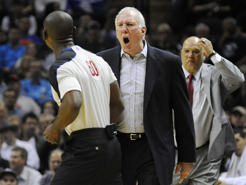 San Antonio Spurs head coach Gregg Popovich, center, yells at referee James Williams, left, before being ejected in the second half of an NBA basketball game against the New York Knicks, Wednesday, March 7, 2012, in San Antonio. San Antonio won 118-105. (AP Photo/Darren Abate)
