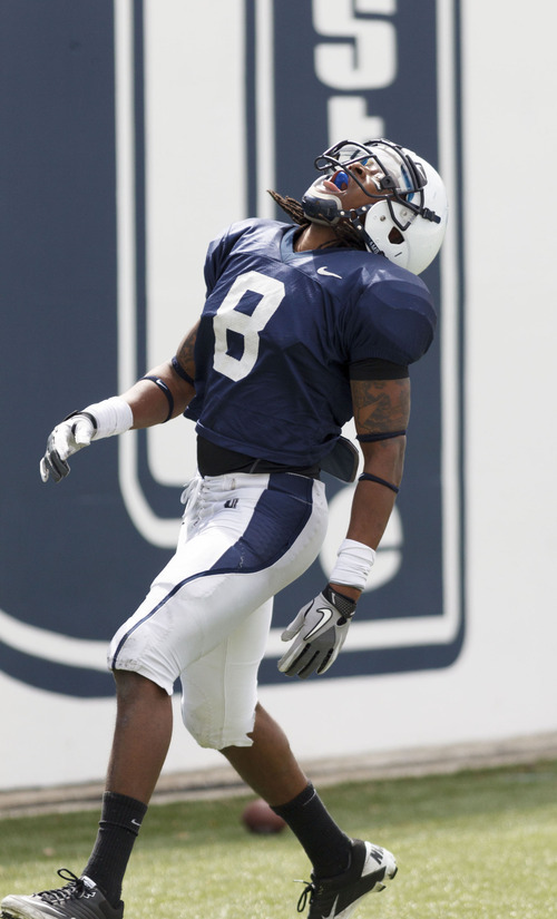 Trent Nelson  |  The Salt Lake Tribune
Receiver Travis Reynolds celebrates a first half touchdown at Utah State's annual Blue and White football game Saturday, April 28, 2012 in Logan, Utah.
