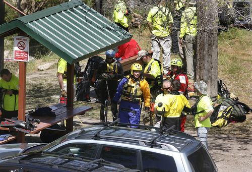 Scott Sommerdorf  |  The Salt Lake Tribune             
Divers put on their gear prior to beginning their search for a missing 3-year-old boy in the Weber River just north of Exchange Roadt in Ogden, Sunday, April 29, 2012.
