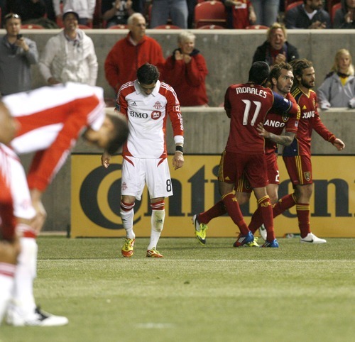 Rick Egan  | The Salt Lake Tribune 

Toronto FC players slump over in disappointment, as Real Salt Lake's Jonny Steele (22)  and Real Salt Lake's Javier Morales (11), celebrate after Salt Lake went up 3-2 in the final minutes of the game, in RSL action, Real Salt Lake vs. Toronto FC, in Salt Lake City, Saturday, April 28, 2012.