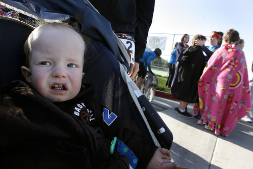 Scott Sommerdorf  |  The Salt Lake Tribune             
Bridger Housley, a 15-month-old born with Larsen's syndrome, a rare connective tissue disorder, was the grand marshal of the Shriners Hospital for Children 5K and 10K fundraiser run on Saturday, April 28, 2012. He waits in his stroller for the start of the run. The run raises money for children born with orthopaedic and neuromusculoskeletal disorders.