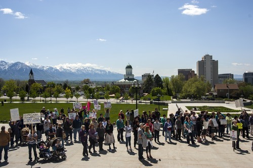 Chris Detrick  |  The Salt Lake Tribune
Participants hold up signs during a Unite Against the War on Women rally at the Utah State Capitol Saturday April 28, 2012.