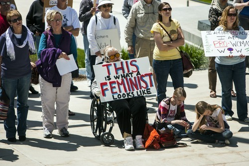 Chris Detrick  |  The Salt Lake Tribune
Participants hold up signs during a Unite Against the War on Women rally at the Utah State Capitol on Saturday.