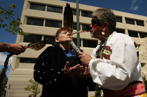 Leah Hogsten  |  The Salt Lake Tribune
For the ninth year Roberta Hatch, a food services worker with St. Mark's Hospital receives a blessing from Arapaho Healer Dorian Two-horses Sanchez Wednesday May 11, 2011. Spiritual leaders from different denominations will conduct a multi-faith blessing of the hands of St. Mark's Hospital caregivers and supporting staff.