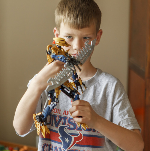 Trent Nelson  |  The Salt Lake Tribune
Jack Wolfinger poses with one of his favorite toys, a Bioncle figure that he assembled, in Ogden, Utah. After the CDC released new data on autism a few weeks ago, some experts are questioning the results. Jack was repeatedly labeled by teachers as possibly autistic, but last year a Utah psychologist said the symptoms were there but the diagnosis did not entirely fit.