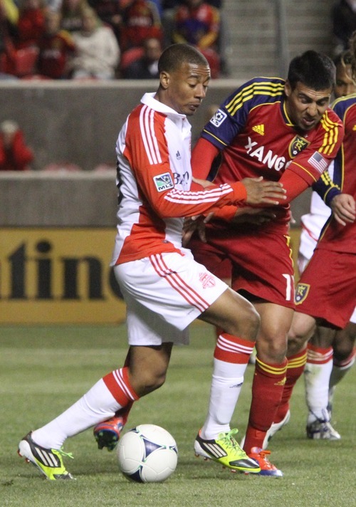 Rick Egan  | The Salt Lake Tribune 

Real Salt Lake's Javier Morales (11)  goes for the ball along with Miguel Aceval (3) of Toronto FC,  in RSL action, Real Salt Lake vs. Toronto FC, in Salt Lake City, Saturday, April 28, 2012.