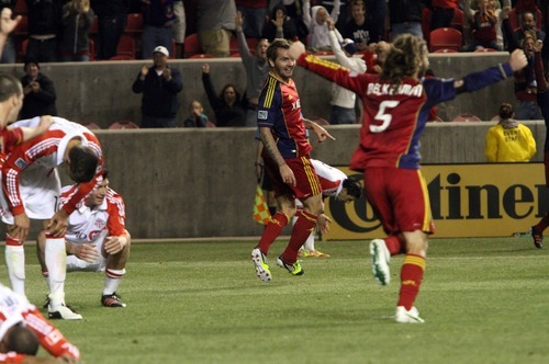 Rick Egan  | The Salt Lake Tribune 

Toronto FC players slump over in disappointment, as Real Salt celebrates after Salt Lake went up 3-2 in the final minutes of the game,  in RSL action, Real Salt Lake vs. Toronto FC, in Salt Lake City, Saturday, April 28, 2012.
