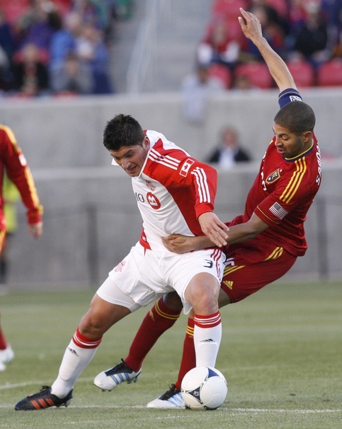 Rick Egan  | The Salt Lake Tribune 

Real Salt Lake's Alvaro Saborio (15)  goes after the ball along with Miguel Aceval, Toronto FC, in RSL action, Real Salt Lake vs.Toronto FC,  in Salt Lake City, Saturday, April 28, 2012.