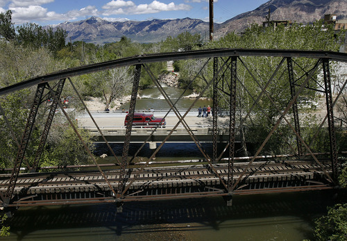 Scott Sommerdorf  |  The Salt Lake Tribune             
The area where search and rescue personnel search for a missing 3-year-old boy in the Weber River just north of Exchange Road in Ogden, Sunday, April 29, 2012.