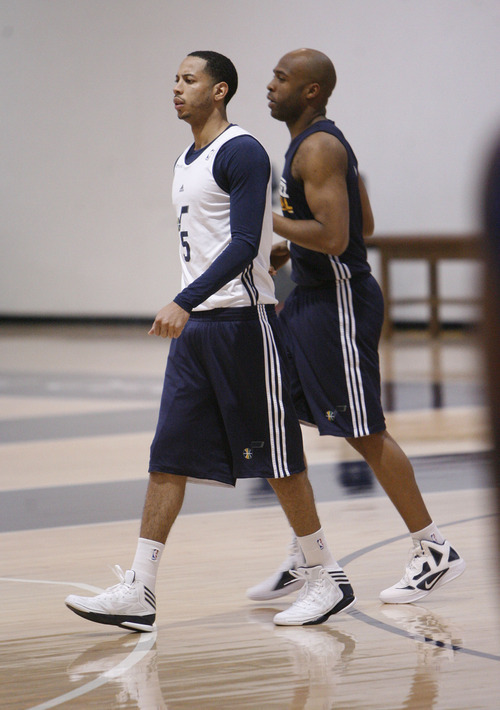 Francisco Kjolseth  |  The Salt Lake Tribune
Utah point guard Devin Harris, left, and Jamaal Tinsley join the team for practice on Tuesday, May 1, 2012 as the Utah Jazz get ready for round two of the playoffs against San Antonio at the Zions Bank Basketball Center. Much of their work hinders on their ability to defend Tony Parker of the Spurs.