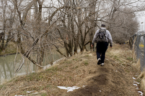 Trent Nelson  |  The Salt Lake Tribune
John, a homeless man, walks to his tent in a homeless camp along the Jordan River in Salt Lake City on Thursday, Jan. 26, 2012. Utah's annual statewide Point-in-Time homeless count is under way across the state.