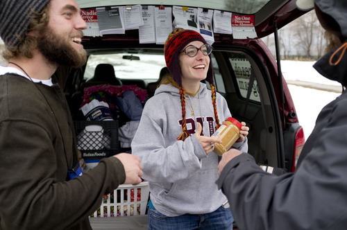 Trent Nelson  |  The Salt Lake Tribune
Buddy Tymczyszyn, left, and Kimberly Bell, of Volunteers of America, give food and other items to a homeless man named Cliff while working on Utah's annual statewide Point-in-Time homeless count in Salt Lake City on Thursday, Jan. 26, 2012.