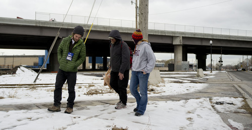Trent Nelson  |  The Salt Lake Tribune
Buddy Tymczyszyn, left, and Kimberly Bell, right, of Volunteers of America, speak with a homeless man named Cliff while working on Utah's annual statewide Point-in-Time homeless count in Salt Lake City on Thursday, Jan. 26, 2012.