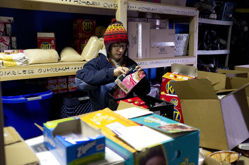 Trent Nelson  |  The Salt Lake Tribune
Kimberly Bell, of Volunteers of America, loads up on supplies before heading out to work on Utah's annual statewide Point-in-Time homeless count in Salt Lake City on Thursday, Jan. 26, 2012.