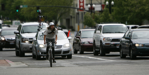 Francisco Kjolseth  |  The Salt Lake Tribune
Bicyclists make their way through down town traffic on Monday, April 30, 2012. Mayor Ralph Becker has scrapped the Mayor's Bicycle Advisory Committee.