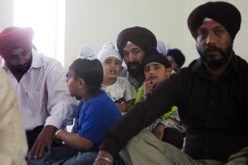 Kim Raff | The Salt Lake Tribune
Men listen during a weekly Sikh worship service at the Sikhs of Utah Temple in Taylorsville on April 22, 2012.