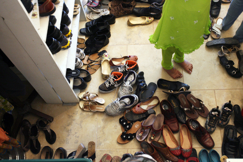 Kim Raff | The Salt Lake Tribune
People find their shoes to leave after a Sikhs of Utah worship service at the Sikh Temple in Salt Lake City, Utah on April 22, 2012.