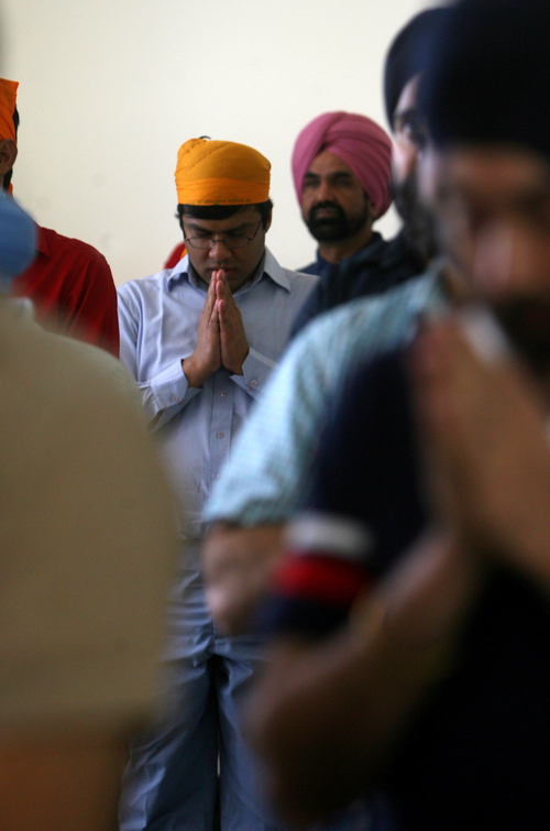 Kim Raff | The Salt Lake Tribune
Men stand and pray during a Sikhs of Utah worship service at the Sikh Temple in Salt Lake City, Utah on April 22, 2012.