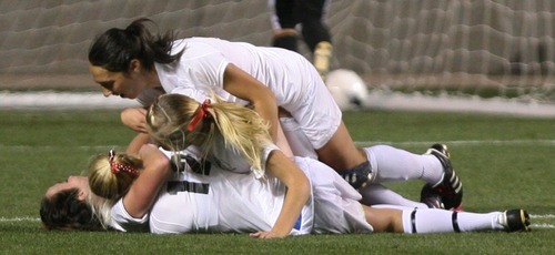 Steve Griffin  |  The Salt Lake Tribune


Alta's senior Michelle Murphy, bottom, is mobbed by her teammates after scoring the only goal during the girl's 5A championship soccer game between Alta and Viewmont at Rio Tinto Stadium in Sandy, Utah Friday, October 21, 2011.