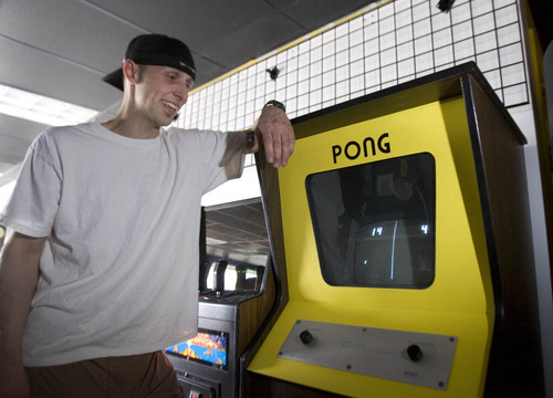 Paul Fraughton  |  The Salt Lake Tribune
Chris Wright, owner of Atomic Arcade, stands next to the Pong, the iconic Atari game that started the video game craze. Wright keeps this game in a roped-off area of the Holladay arcade for play only with permission.