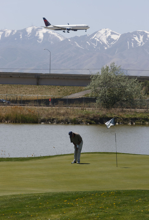 Trent Nelson  |  The Salt Lake Tribune
Henry Cameron putts on the 8th hole at Salt Lake City's Wingpointe golf course Wednesday, May 2, 2012. A demand from the FAA could cause a dramatic increase in Wingpointe's lease.