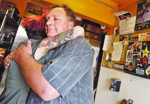 Leah Hogsten  |  The Salt Lake Tribune
Morgan Valley Lamb owner Jamie Gillmor gets a hug from one of the owners of The Tin Angel Cafe, Robin Fairchild after Gillmor told her he had to end his business, Thursday, May 3 2012 in Salt Lake City. 
Morgan Valley Lamb, in business since 2001, is closing down its operations. After three generations of sheep ranchers, the extended family has decided to sell off all of its grazing lands in northern Utah.  He said he cannot afford to buy the entire 10,000 acre parcel.